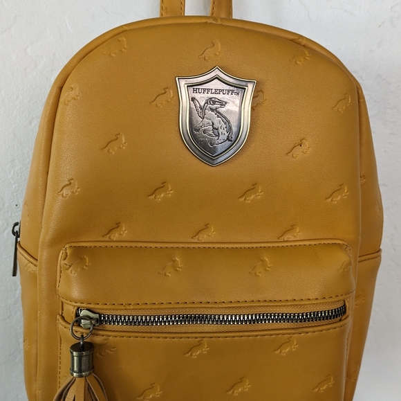 Warner Bros. Handbags - Harry Potter Hufflepuff Faux Leather Mini Backpack⚜️💛💛🪄🧙